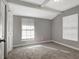 Bright bedroom with large window and neutral walls at 2002 E Ellicott St, Tampa, FL 33610