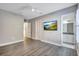 Bright bedroom with wood-look floors and an ensuite bathroom at 20105 Umbria Hill Dr, Tampa, FL 33647