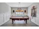 Game room featuring a billiard table and built-in shelving at 20105 Umbria Hill Dr, Tampa, FL 33647