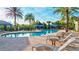 Community pool with plenty of lounge chairs for relaxing at 20105 Umbria Hill Dr, Tampa, FL 33647