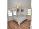 Spacious bedroom with hardwood floors and ample natural light at 207 S Mcmullen Booth Rd # 198, Clearwater, FL 33759