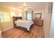 Bright bedroom with hardwood floors and dresser at 207 S Mcmullen Booth Rd # 198, Clearwater, FL 33759