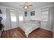 Comfortable bedroom with hardwood floors and large windows at 207 S Mcmullen Booth Rd # 198, Clearwater, FL 33759