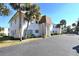 Side view of a two-story building with parking and lush landscaping at 207 S Mcmullen Booth Rd # 198, Clearwater, FL 33759