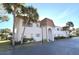 Front view of a two-story building with a brown roof and a landscaped area at 207 S Mcmullen Booth Rd # 198, Clearwater, FL 33759