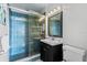 Updated bathroom with blue tile shower and vanity at 2109 Bayshore Blvd # 602, Tampa, FL 33606