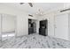 Modern kitchenette with dark cabinetry and marble floors at 2109 Bayshore Blvd # 602, Tampa, FL 33606