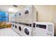 Well-equipped laundry room with multiple washers and dryers at 2109 Bayshore Blvd # 602, Tampa, FL 33606