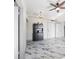 Living room features marble floors, a ceiling fan, and stylish storage cabinet at 2109 Bayshore Blvd # 602, Tampa, FL 33606