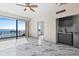 Living room boasts marble floors and sliding doors to balcony with water views at 2109 Bayshore Blvd # 602, Tampa, FL 33606