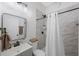 Modern bathroom with a walk-in shower and updated fixtures at 2504 W Fletcher Ave, Tampa, FL 33618