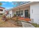 Welcoming front porch with red tile and landscaping at 2504 W Fletcher Ave, Tampa, FL 33618