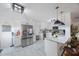 Modern kitchen with white cabinets and marble countertops at 2504 W Fletcher Ave, Tampa, FL 33618