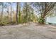 Fire pit area with surrounding logs at 26451 Glenhaven Rd, Wesley Chapel, FL 33544