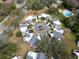 Aerial view of a residential community with homes and a pool at 2650 Barksdale Ct, Clearwater, FL 33761