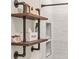 Bathroom featuring industrial-style shelves above toilet at 2650 Barksdale Ct, Clearwater, FL 33761