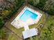 Aerial view of community pool with surrounding lounge chairs and landscaping at 2650 Barksdale Ct, Clearwater, FL 33761