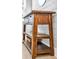 Rustic wooden entry table with drawers and shelves at 2650 Barksdale Ct, Clearwater, FL 33761