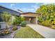 Side view of condo showcasing landscaping and carport at 2650 Barksdale Ct # 0, Clearwater, FL 33761