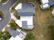 Top-down view of a house with gray roof and white flat roof addition at 2650 Barksdale Ct # 0, Clearwater, FL 33761