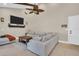 Bright and airy living room featuring a sectional sofa and wood coffee table at 2650 Barksdale Ct # 0, Clearwater, FL 33761