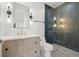 Contemporary bathroom with dark tile shower and floating vanity at 2707 N Woodrow Ave # 3, Tampa, FL 33602