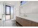 Modern bathroom with wood vanity and herringbone tile floor at 2707 N Woodrow Ave # 3, Tampa, FL 33602