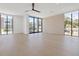 Bright and airy bedroom with hardwood floors and large windows at 2707 N Woodrow Ave # 3, Tampa, FL 33602