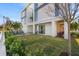 Landscaped lawn with tropical plants and modern home exterior at 2707 N Woodrow Ave # 3, Tampa, FL 33602