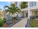 Landscaped walkway leading to the front entrance, featuring lush tropical plants at 2707 N Woodrow Ave # 3, Tampa, FL 33602