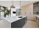 Modern kitchen with island, stainless steel appliances, and light wood cabinets at 2707 N Woodrow Ave # 3, Tampa, FL 33602