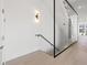 Modern glass and metal staircase with light wood steps at 2707 N Woodrow Ave # 3, Tampa, FL 33602