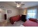 Guest bedroom with two twin beds, ceiling fan and plenty of natural light at 276 Rochester St, Spring Hill, FL 34609