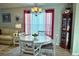 Dining room featuring a round table, four chairs, and a corner cabinet at 276 Rochester St, Spring Hill, FL 34609