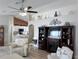 Living room with built-in shelving, fireplace, and view into kitchen at 276 Rochester St, Spring Hill, FL 34609