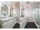 Updated bathroom with double vanity and walk-in shower at 2812 W Neptune St, Tampa, FL 33629