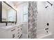 Updated bathroom with double vanity, marble countertop, and subway tile shower at 2812 W Neptune St, Tampa, FL 33629