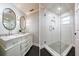 Updated bathroom with double vanity and walk-in shower at 2812 W Neptune St, Tampa, FL 33629