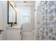 Modern bathroom with double vanity, marble countertop, and hexagon tile floor at 2812 W Neptune St, Tampa, FL 33629