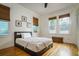 Bedroom with hardwood floors and window coverings at 2812 W Neptune St, Tampa, FL 33629