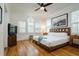 Spacious bedroom with hardwood floors and a ceiling fan at 2812 W Neptune St, Tampa, FL 33629