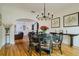 Elegant dining room with a round table, chandelier, and hardwood floors at 2812 W Neptune St, Tampa, FL 33629