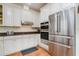 Modern kitchen with stainless steel appliances and granite countertops at 2812 W Neptune St, Tampa, FL 33629