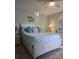 Main bedroom with a queen-size bed and light blue bedding at 3001 58Th S Ave # 203, St Petersburg, FL 33712