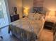 Main bedroom with a double bed, nightstands and access to balcony at 3001 58Th S Ave # 203, St Petersburg, FL 33712