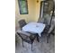 Private patio furnished with table and chairs for relaxing at 3001 58Th S Ave # 203, St Petersburg, FL 33712