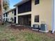 Condo building with screened porch and central air conditioning units at 3001 58Th S Ave # 701, St Petersburg, FL 33712