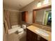 Well-appointed bathroom with tub, toilet and granite vanity at 3001 58Th S Ave # 701, St Petersburg, FL 33712