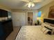 Spacious bedroom with a queen bed, and bathroom access at 3001 58Th S Ave # 701, St Petersburg, FL 33712