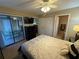 Bedroom with a queen bed, access to a patio, and bathroom at 3001 58Th S Ave # 701, St Petersburg, FL 33712